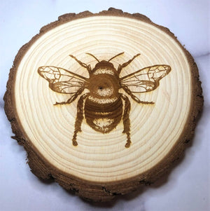 Wood slice coaster with bumble bee